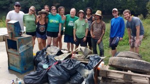 Jack Henderson (center) with a group of volunteers after a river cleanup.