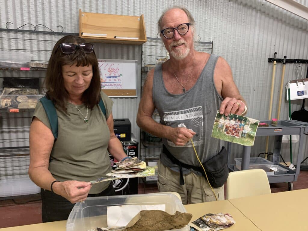 Bill and Liz Auman look through belongings