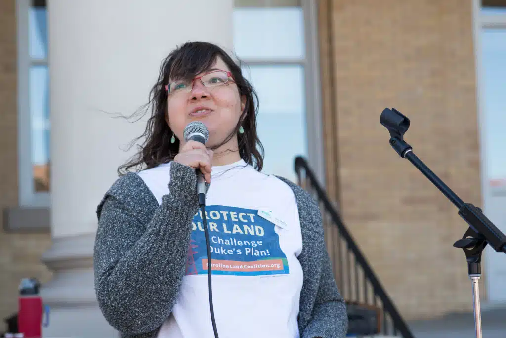 Joan Walker of the Carolina Land Coalition addresses the crowd, and presses the case that "Duke can do better." Protect our Land Picnic in Hendersonville, NC on Sunday, October 18, 2015. Photo credit: katrinaohstrom.com