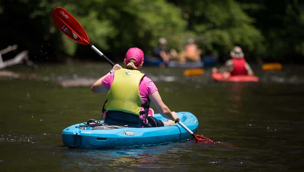 A paddler enjoys a trip on the French Broad River, a critical economic resource for Western North Carolina