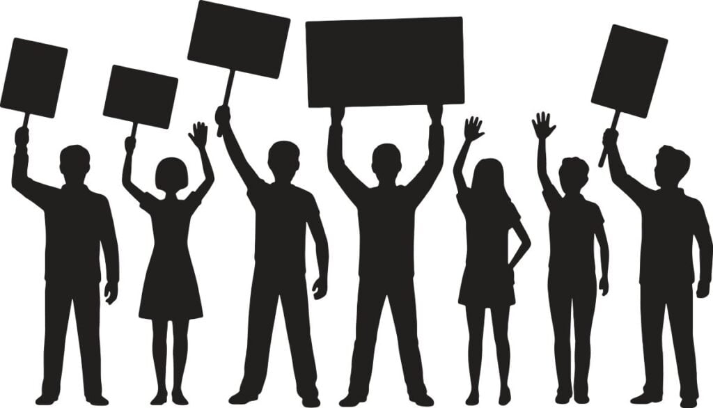 silouhette of people holding signs