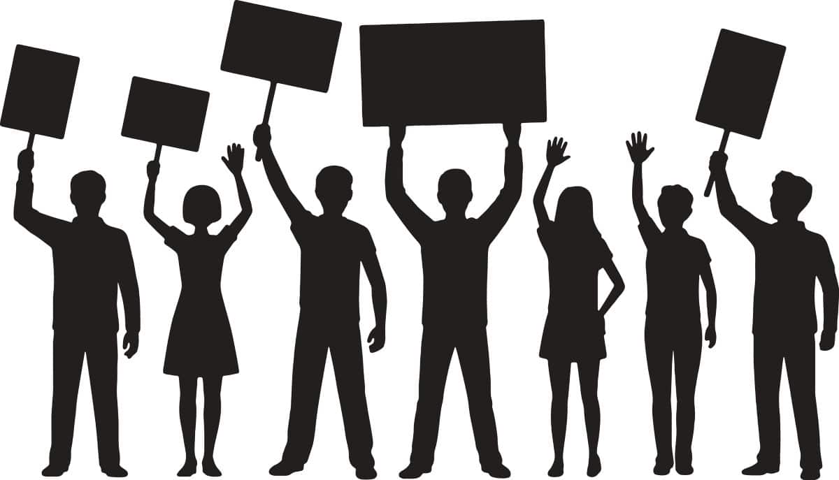 silouhette of people holding signs