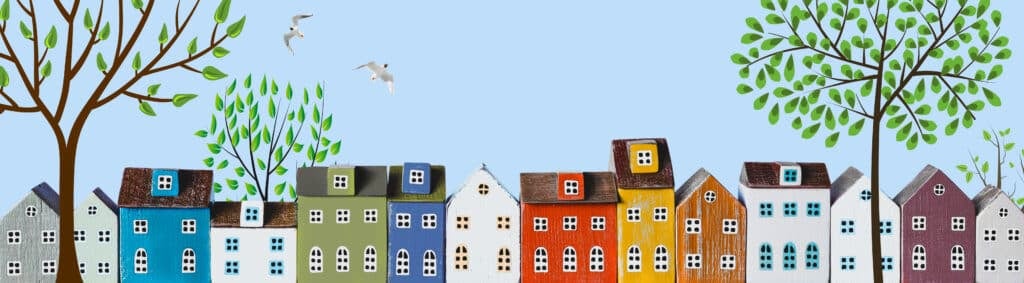 Row of wooden miniature colorful houses in spring town