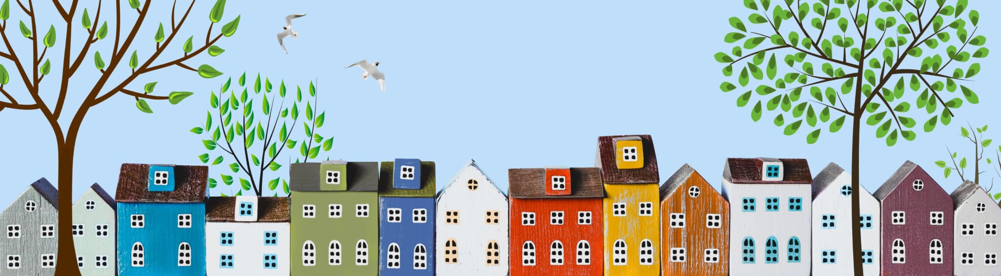 Row of wooden miniature colorful houses in spring town