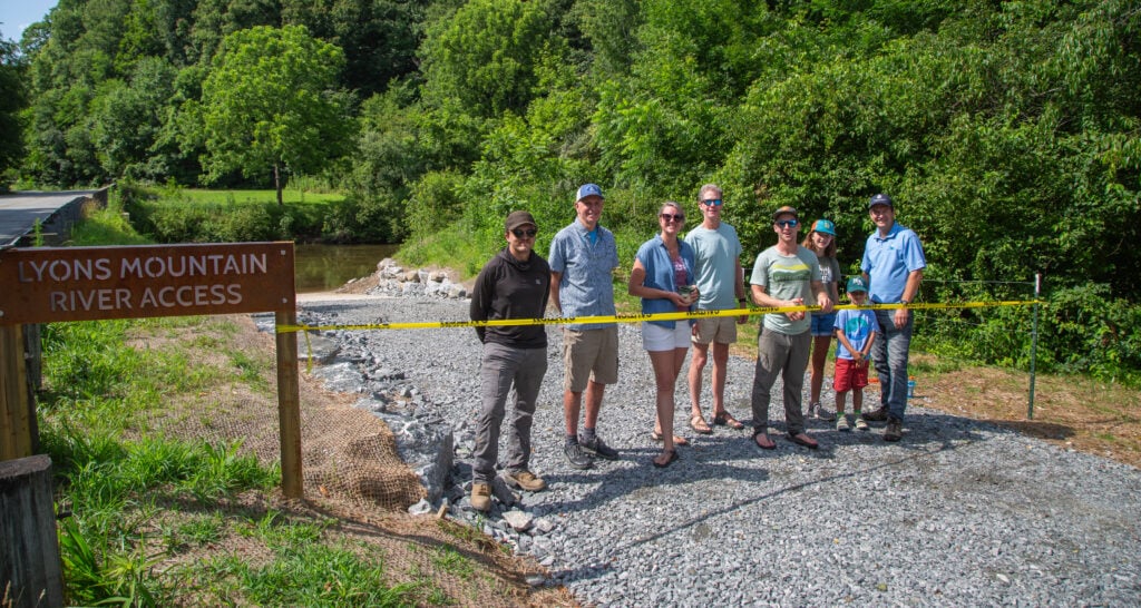 Partners on the Lyons Mountain River Access site in Transylvania County pose on the new boat ramp.