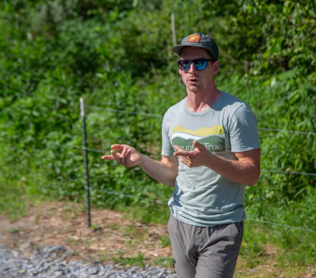 MountainTrue's Paddle Trail Manager Jack Henderson explains the benefits of increasing the prevalence of river access sites at a recent ribbon cutting for the opening of Lyons Mountain River Access in Rosman.